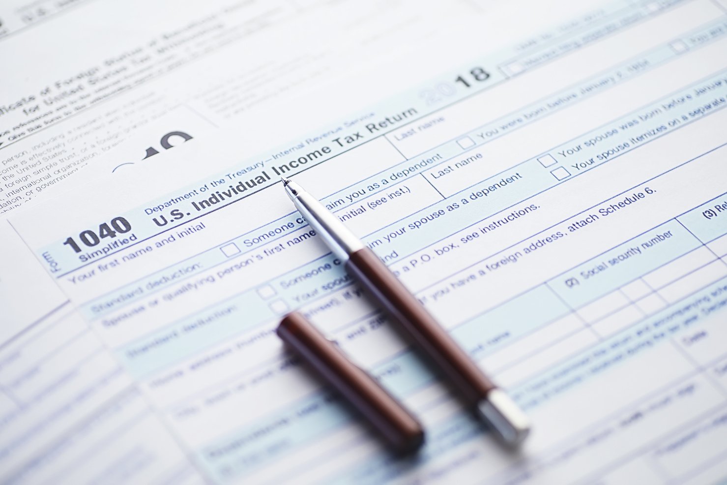 Annual Tax Reporting. Tax Form on the Table. Financial Statement