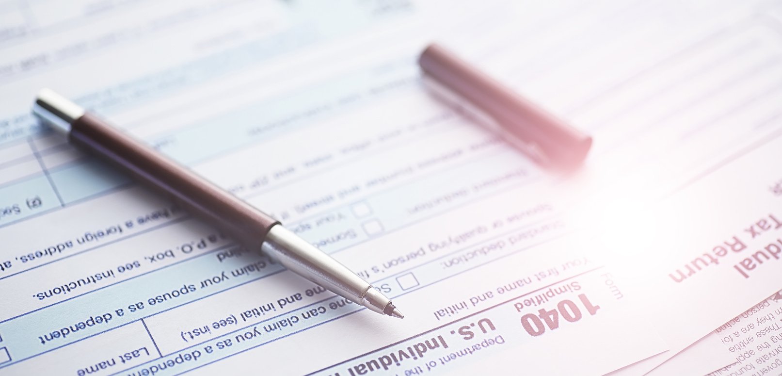 Annual Tax Reporting. Tax Form on the Table. Financial Statement